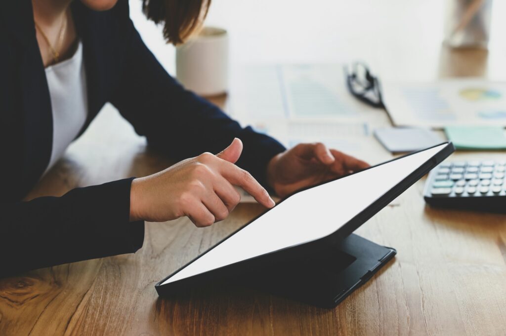 Businesswoman using digital tablet.